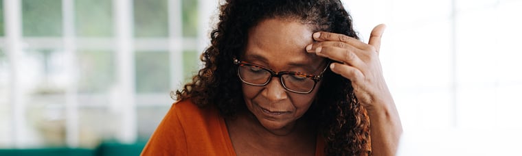 middle-aged woman looking slightly concerned