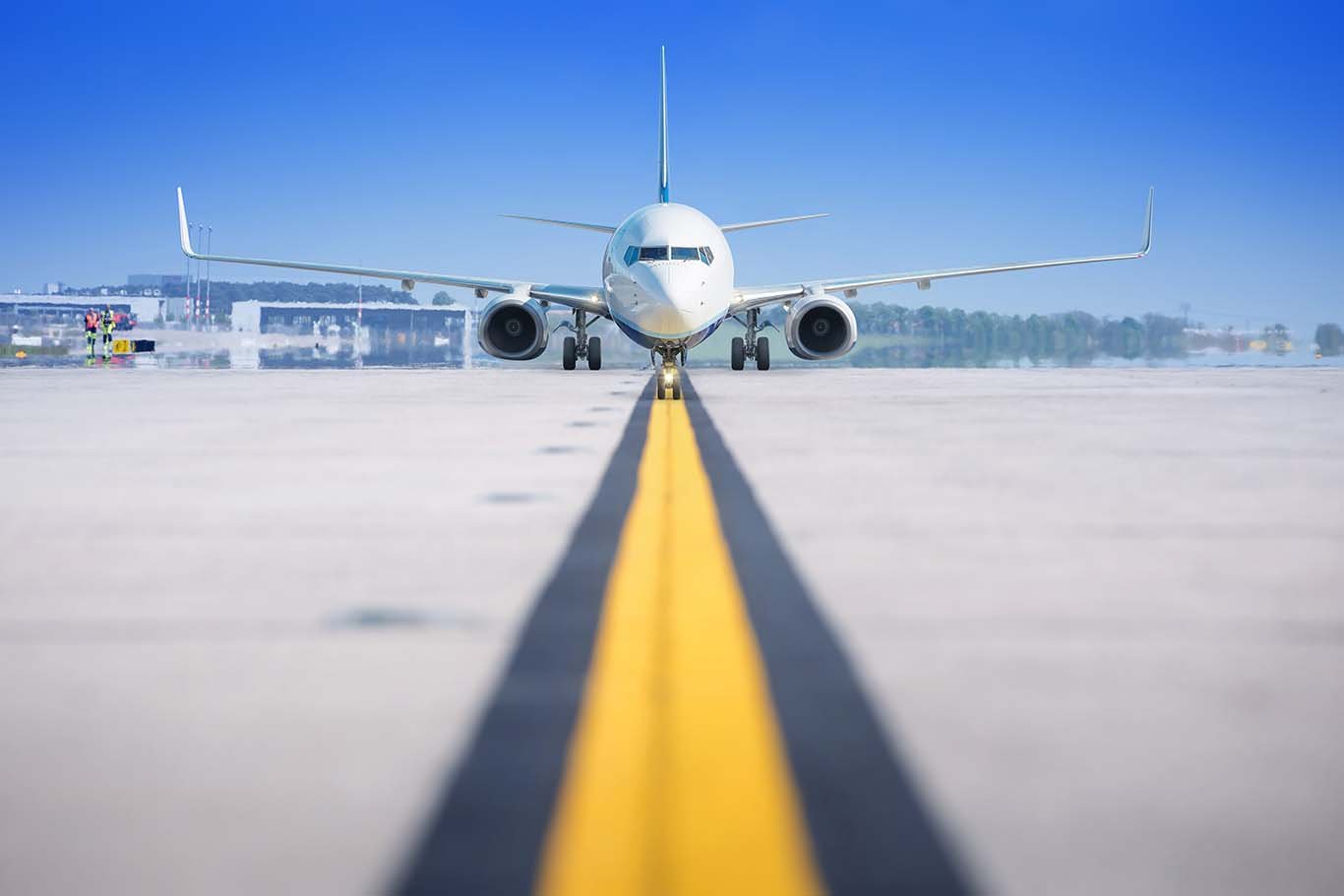 a commercial airplane on the tarmac preparing for takeoff