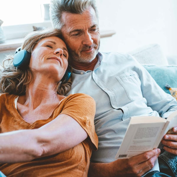 Middle aged couple relaxing on the couch