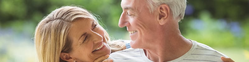 older couple smiling at one another