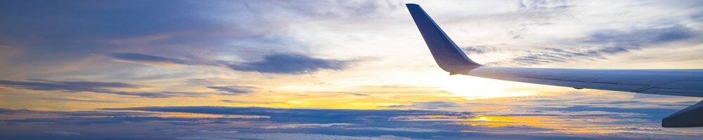 airlines - resources - airplane wing with sunset