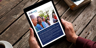 person at a table looking at their tablet displaying the Healthcare guide